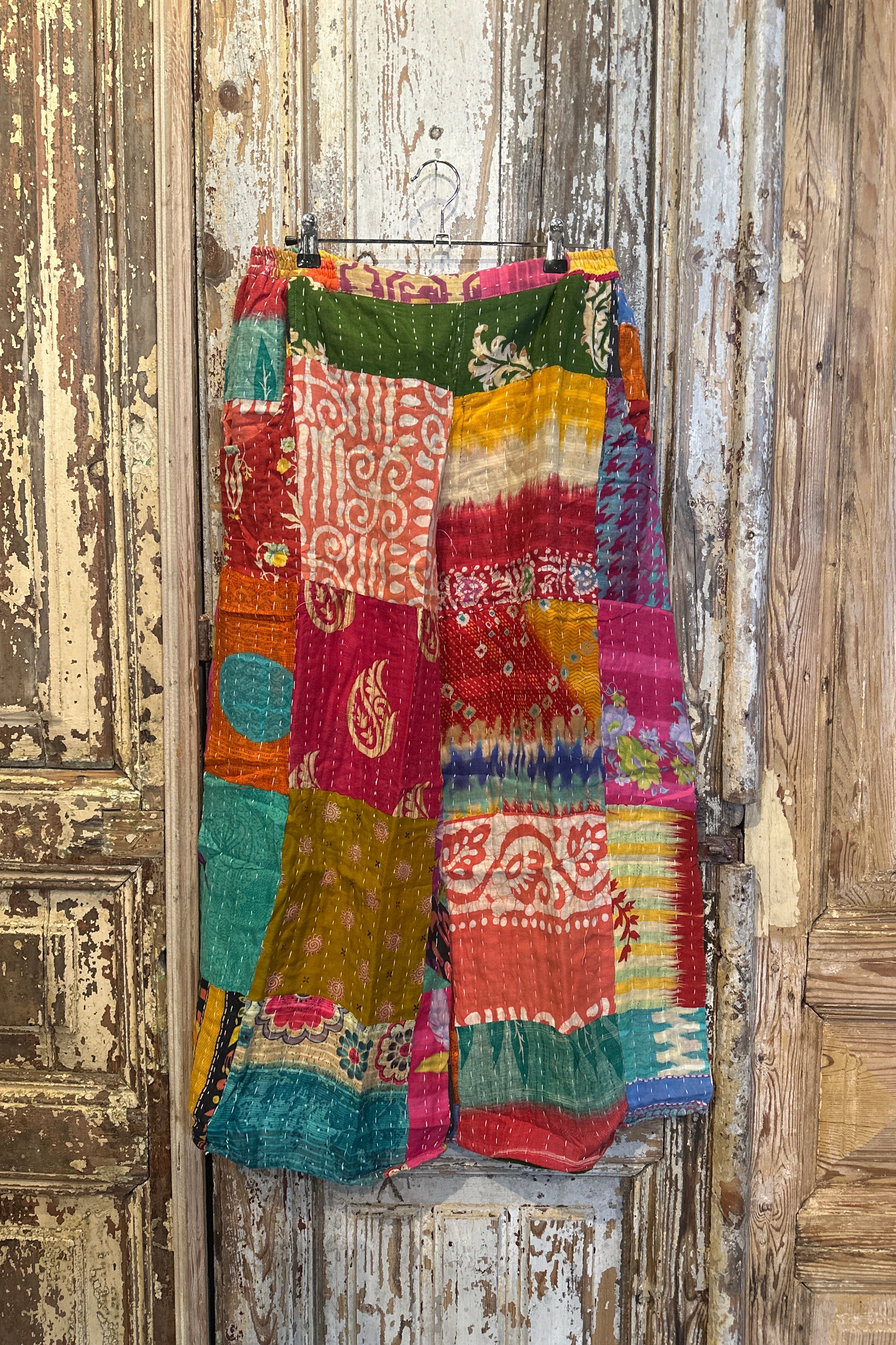 Colorful patchwork fabric on a wooden surface